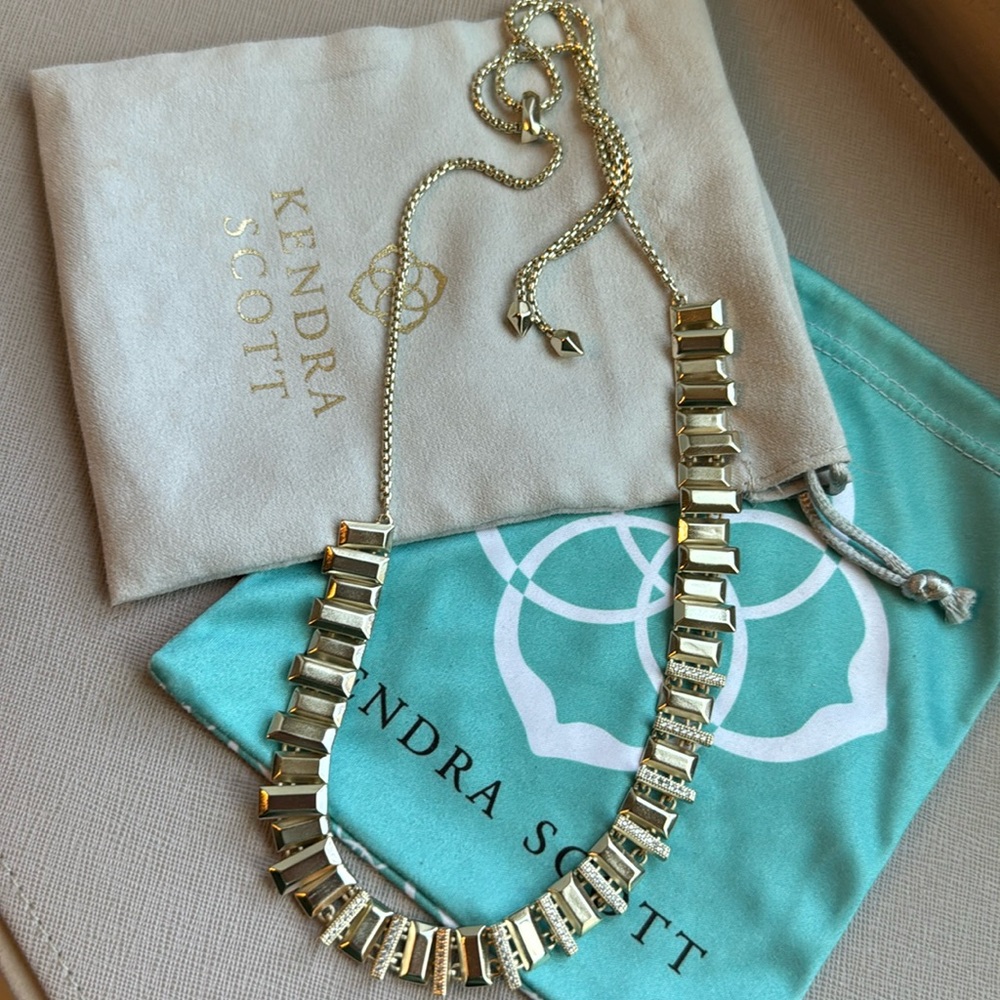 Gold, Kendra Scott, and rhinestone necklace.